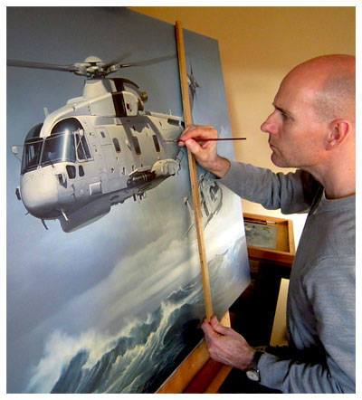 Neil Hipkiss at easel working on commission for Lockheed Martin